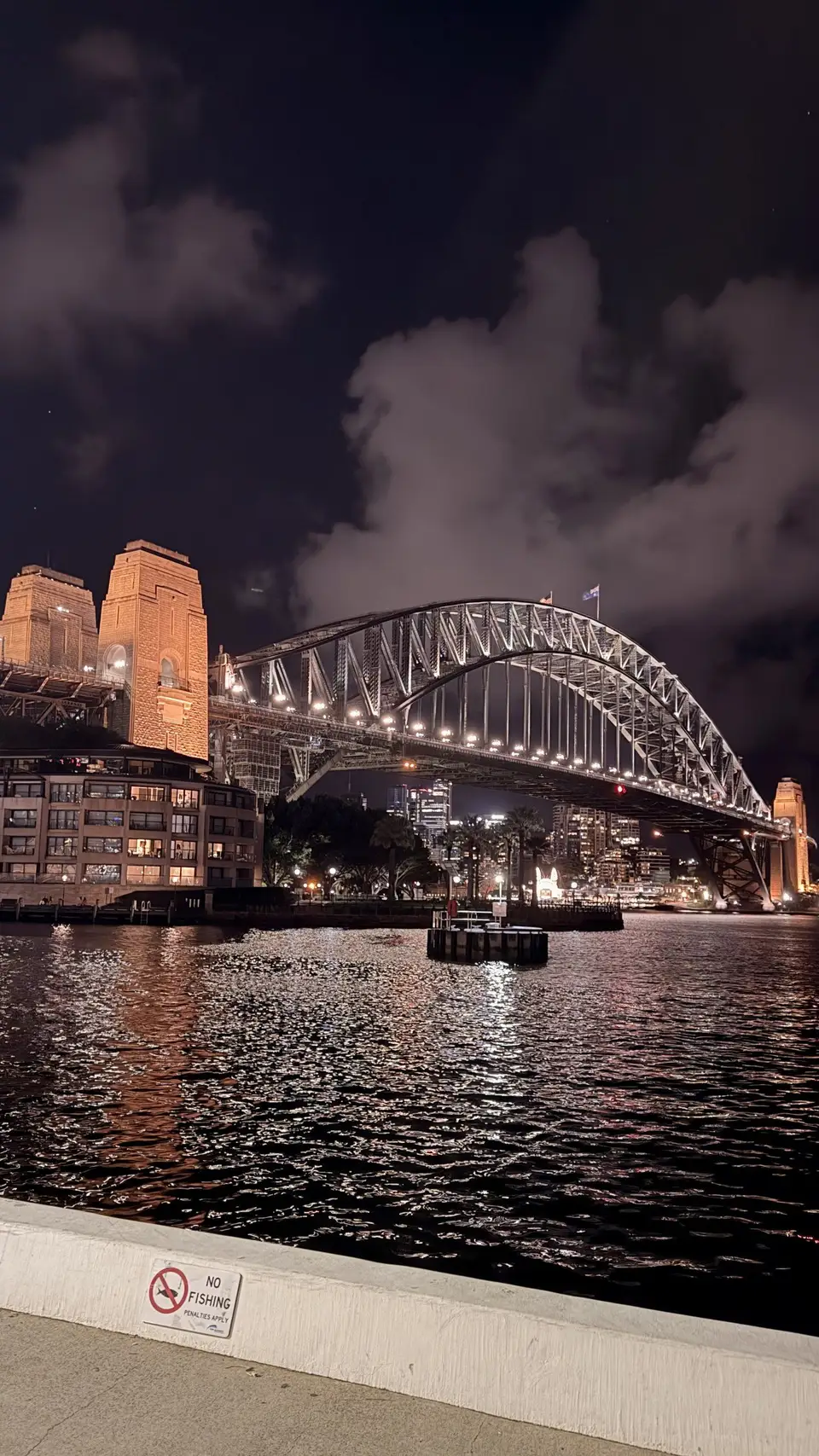 A bridge lit up at night over the water, Sydney, Australia