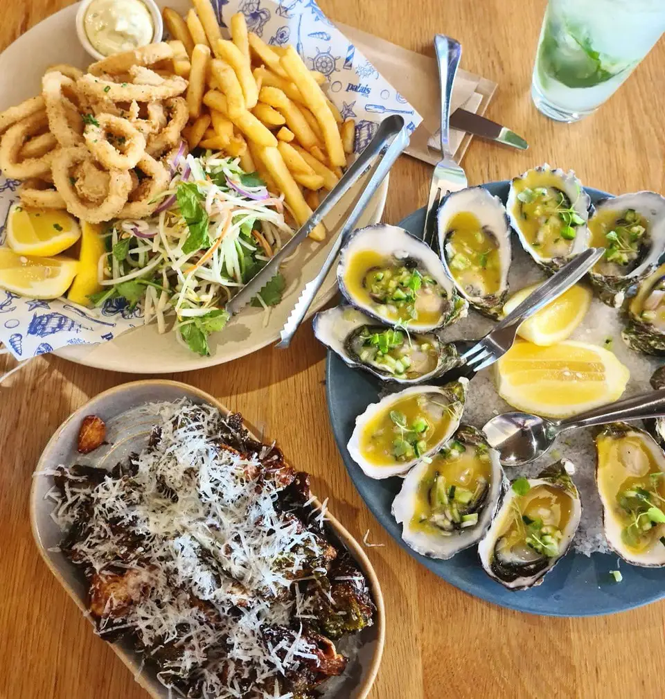 Calamari, fries and oysters on the table